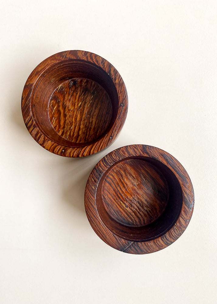 Overhead inside view of two Panga Panga candle holders against white background.